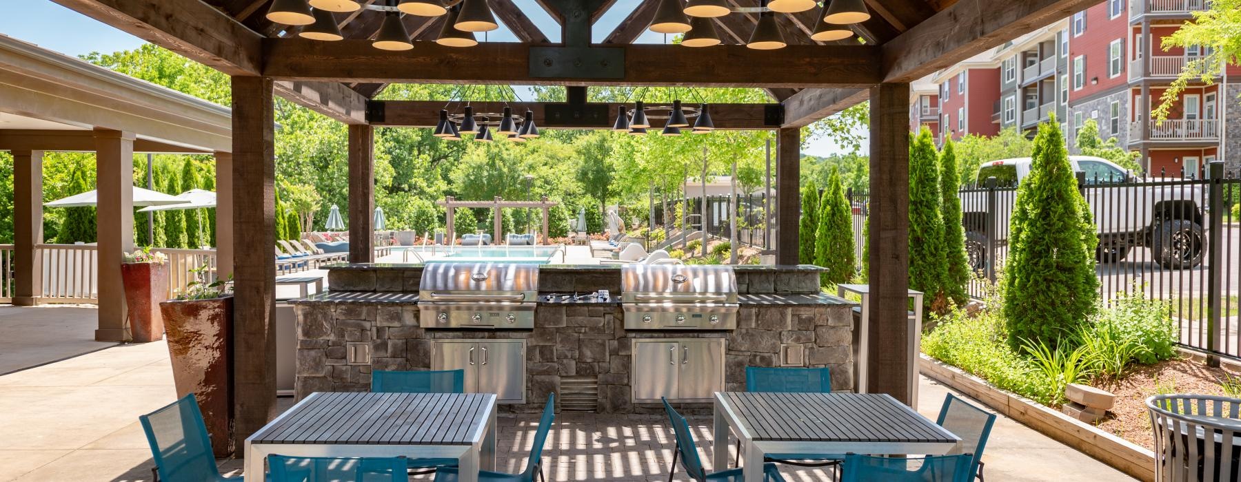 a patio with tables and chairs