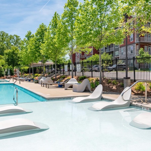 The essence of exceptional living a swimming pool with a building in the background