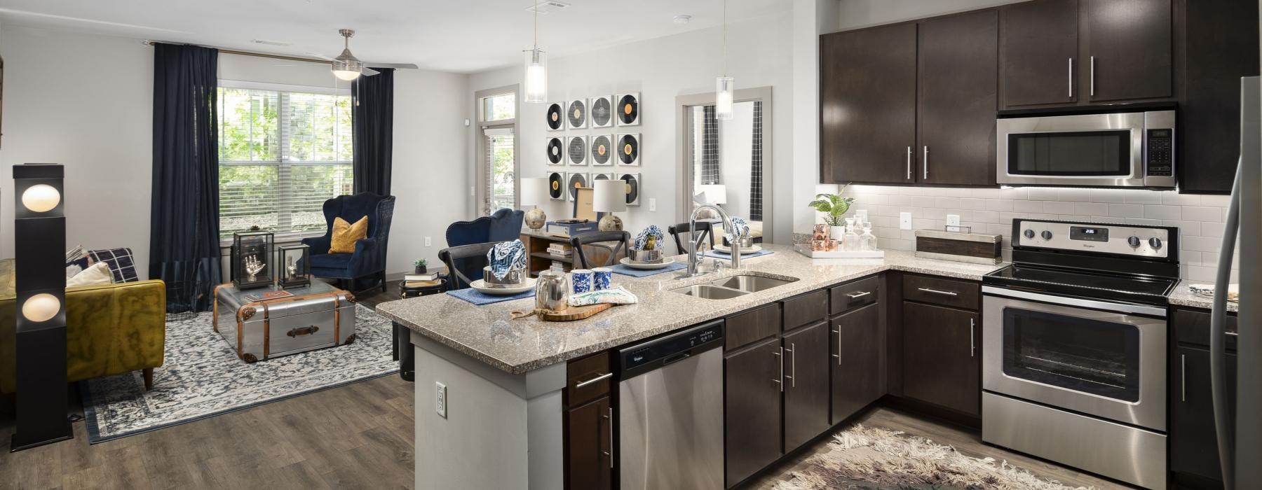 a kitchen with black cabinets