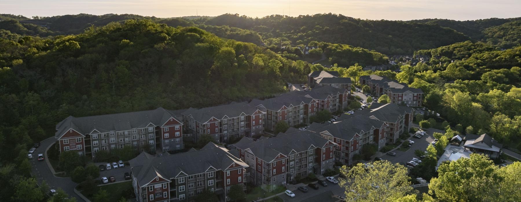 a large building surrounded by trees