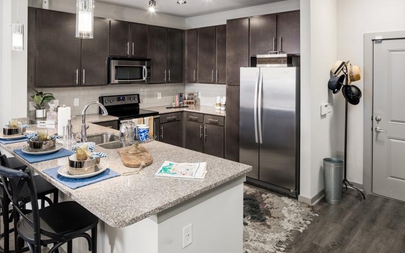 a kitchen with a marble counter